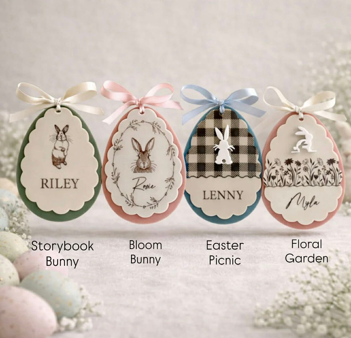 Personalised Easter egg ornaments showing different bunny design styles with custom names and ribbon