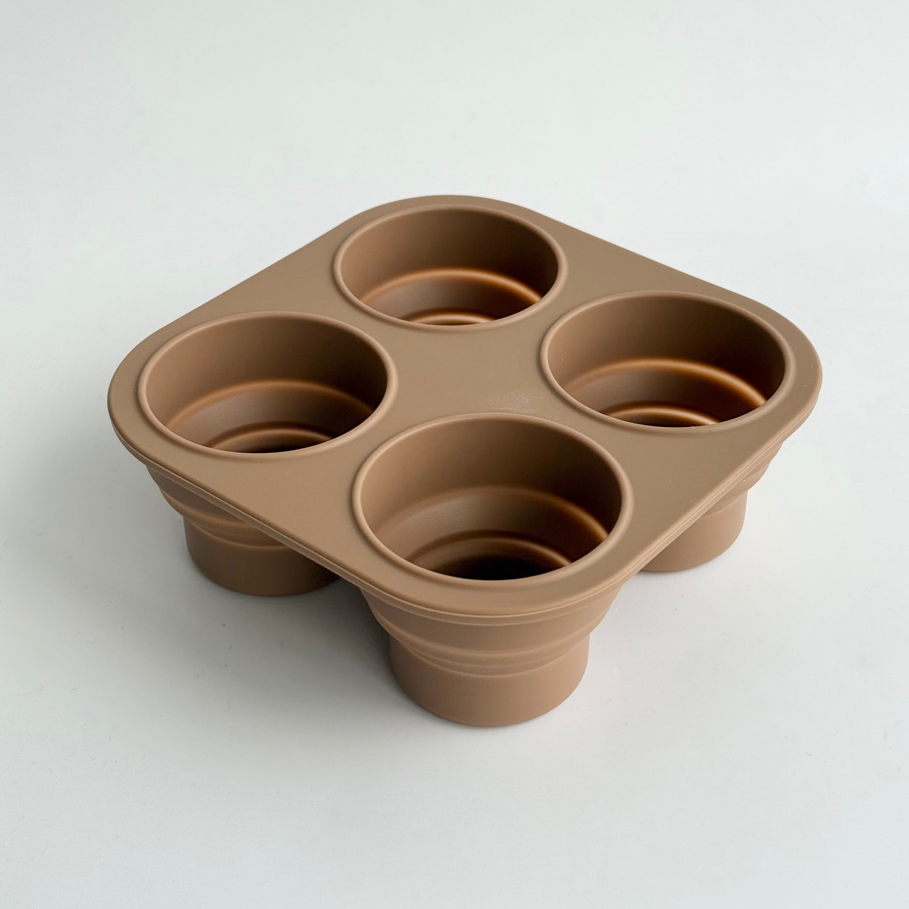 Brown silicone baby food freezer tray with multiple compartments for storing purees and snacks