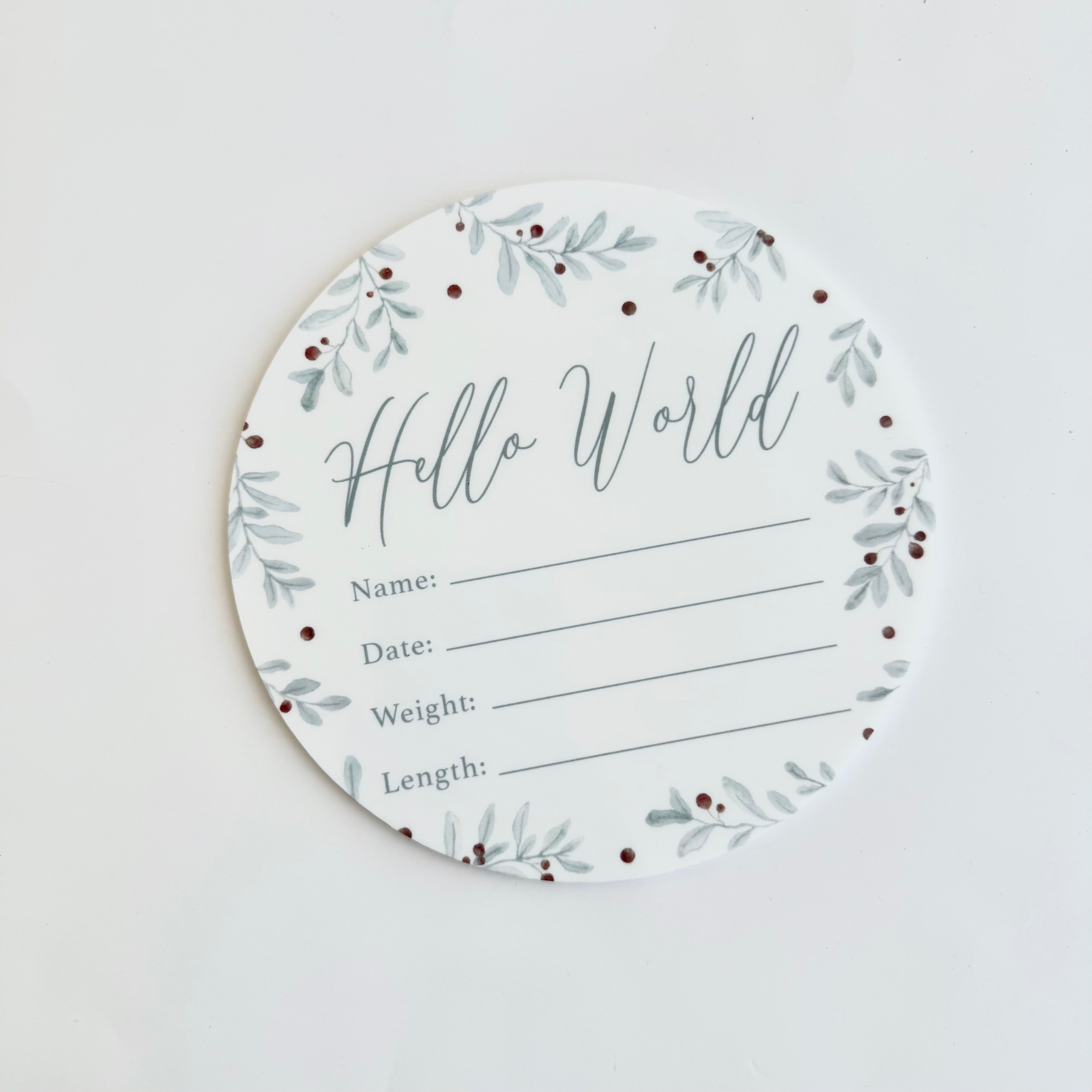 round hello world baby birth announcement card with sage green leaf design for recording newborn details