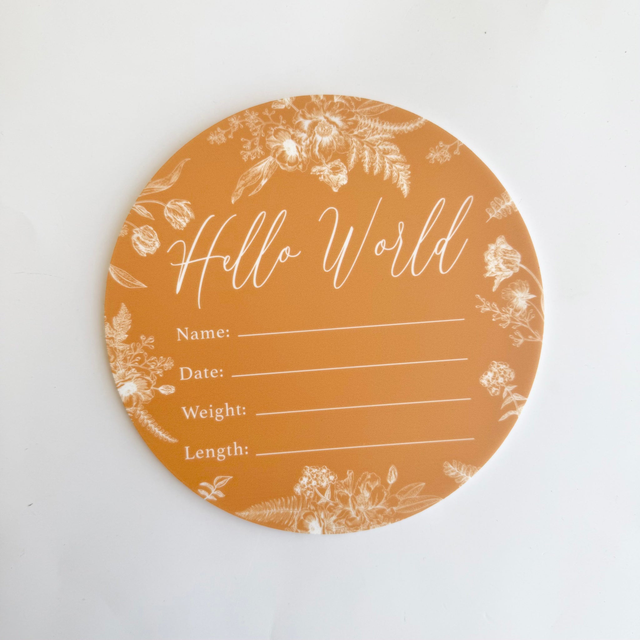 round hello world birth announcement card with neutral floral design for recording baby birth details