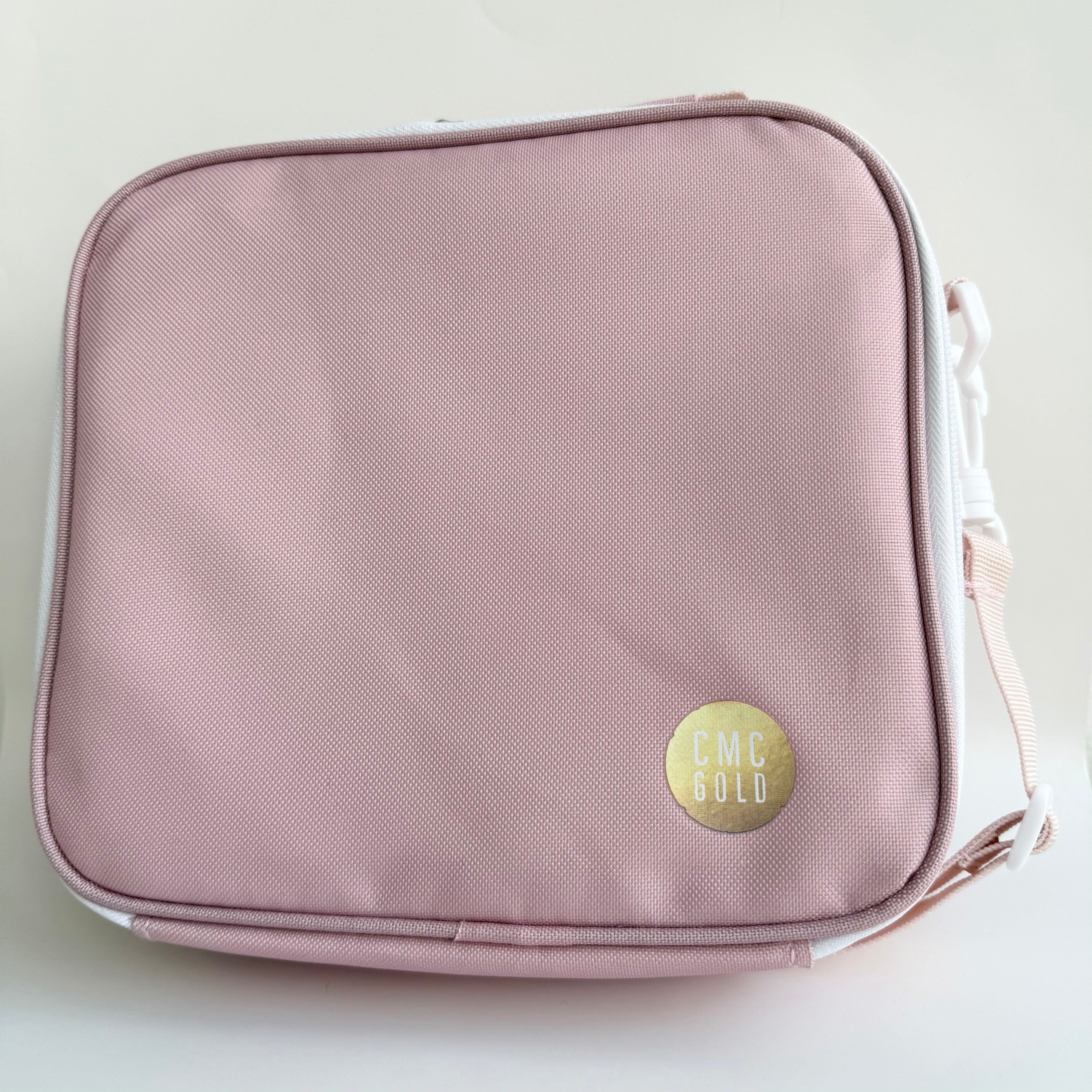 Blush insulated kids bento lunch bag with CMC Gold logo, simple minimalist design for school or daycare