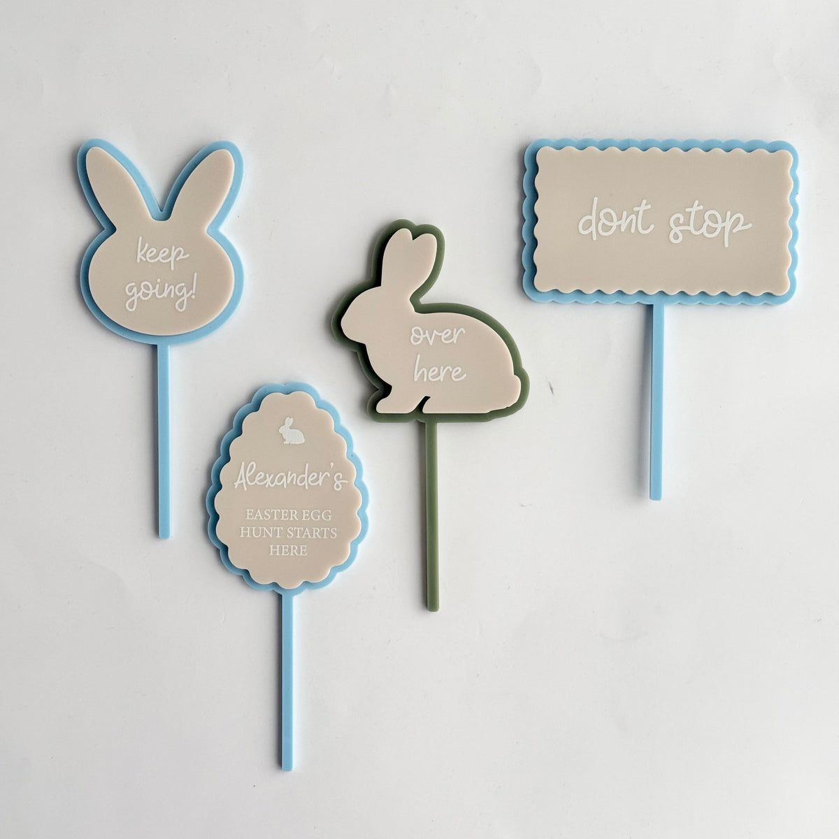 Pastel Easter bunny and egg hunt signs with phrases like “keep going” and “don’t stop” designed as decorative markers for kids Easter activities