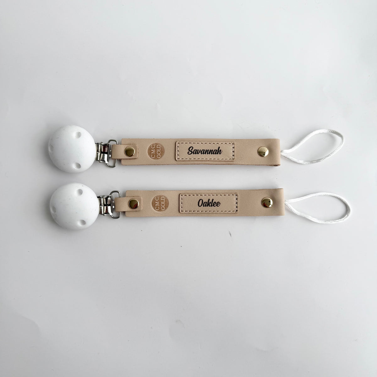 Personalised name engraved dummy clips with white silicone clip and loop attachment.