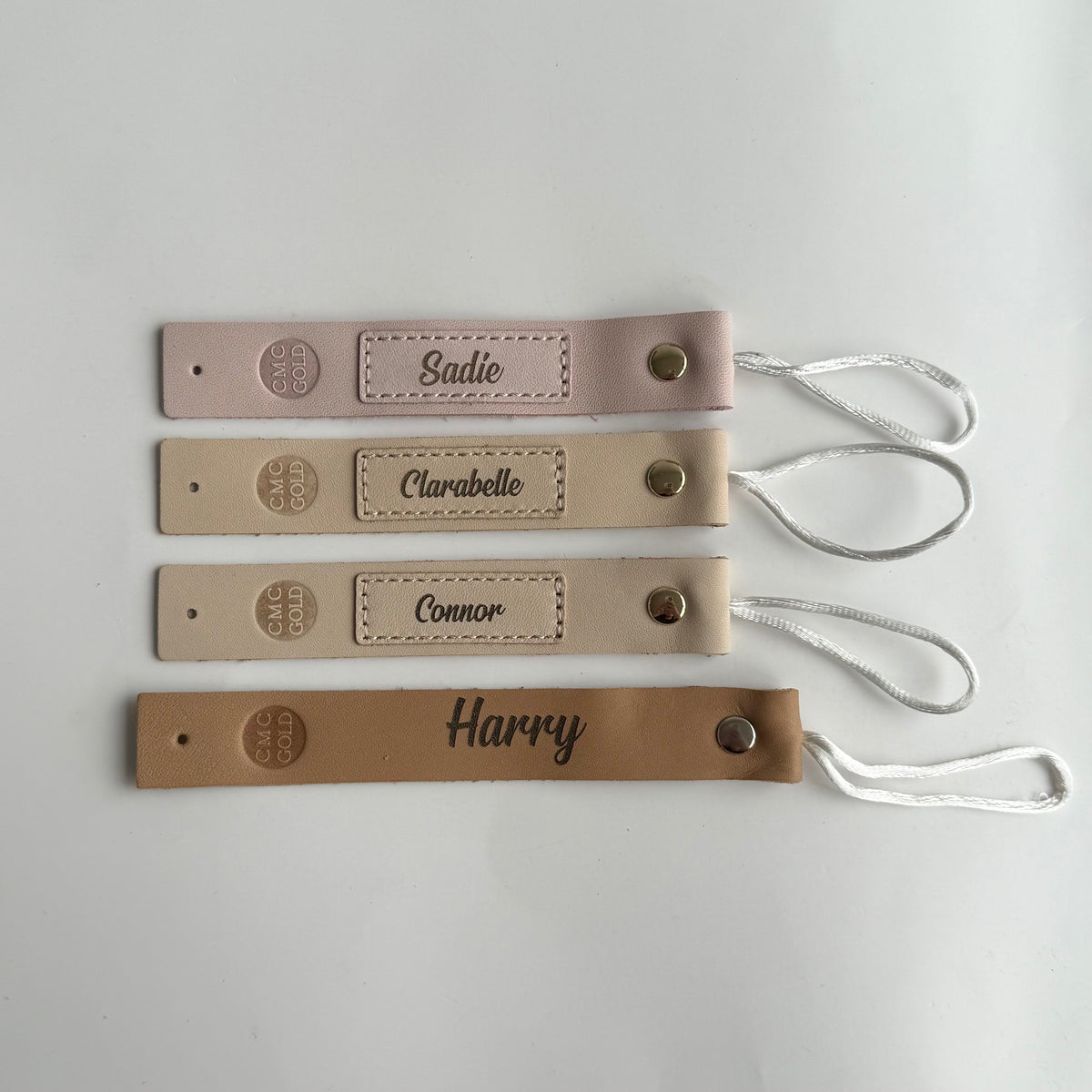 Personalised name engraved dummy clips with loop attachment in neutral colours