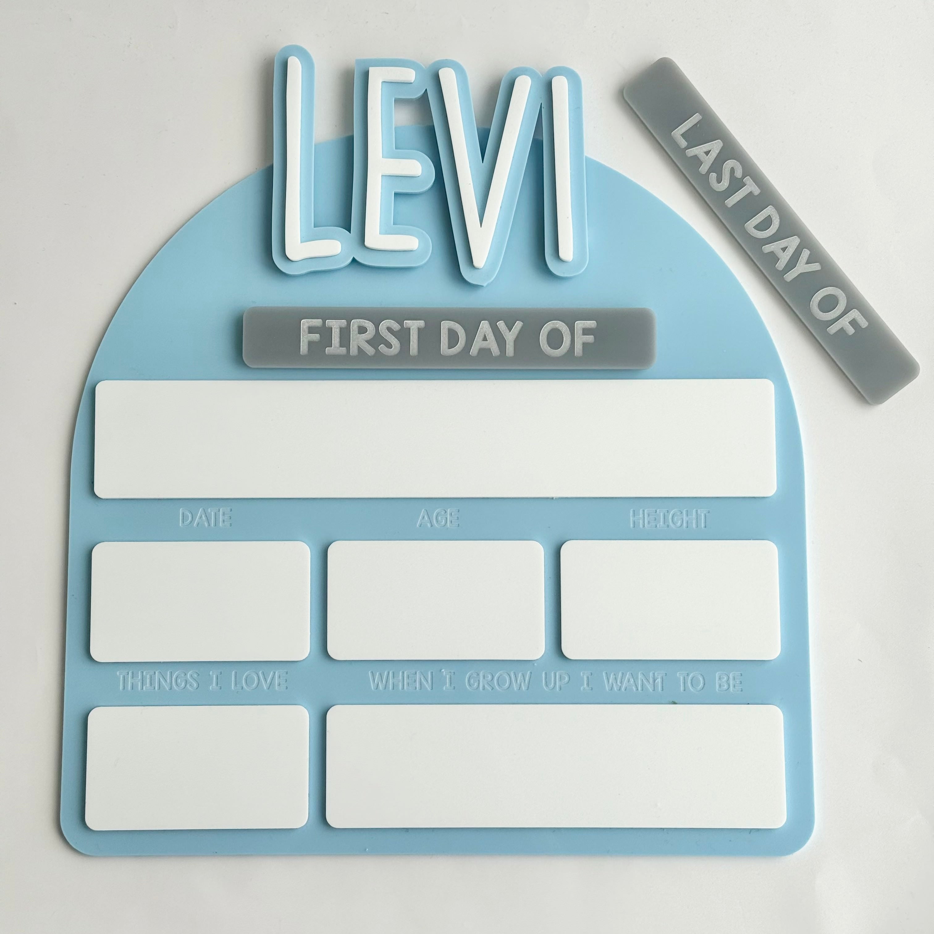Personalised first day of school board with the name Levi, featuring reusable sections for age, date, height and favourite things