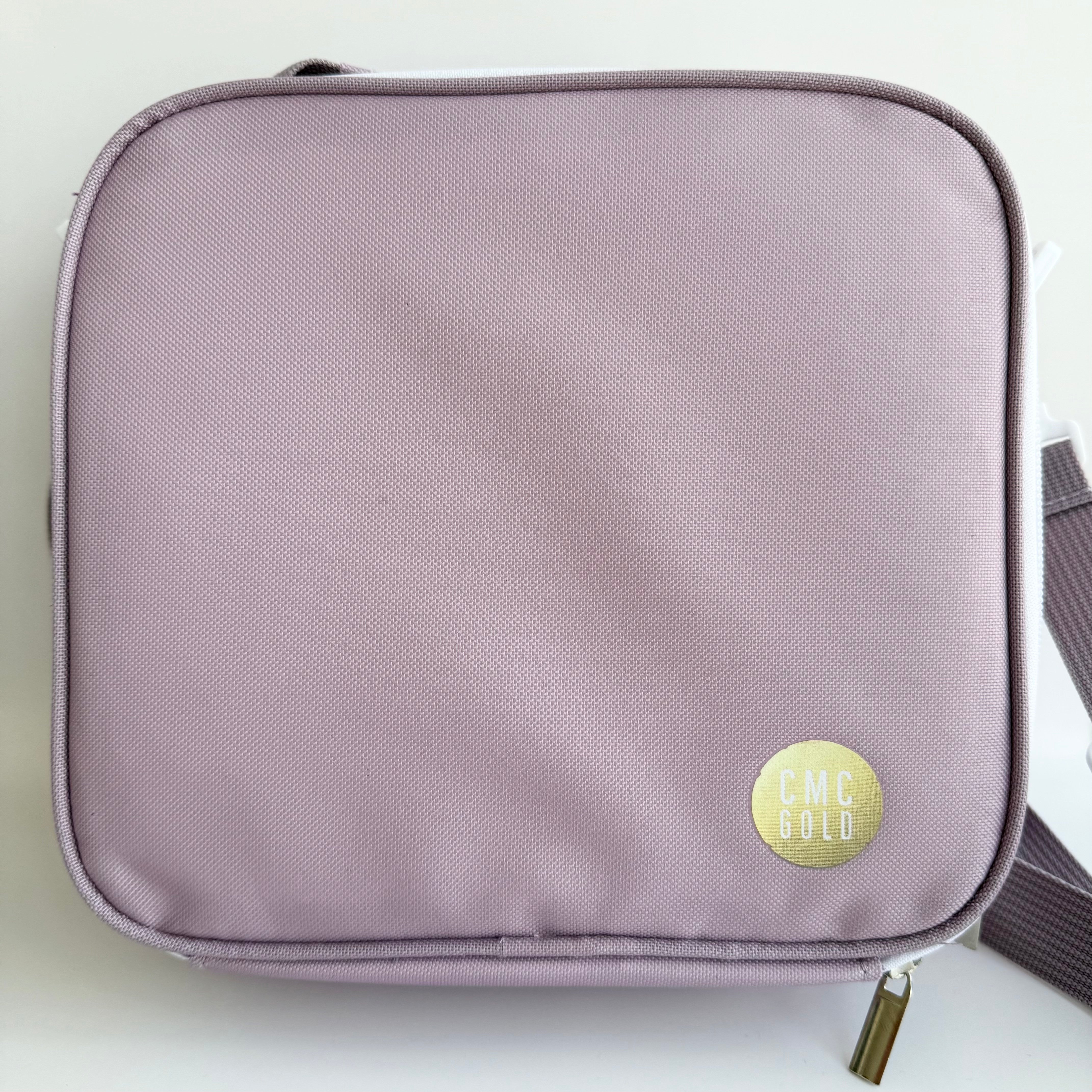 Lavender insulated kids bento lunch bag with CMC Gold logo, simple minimalist design for school or daycare