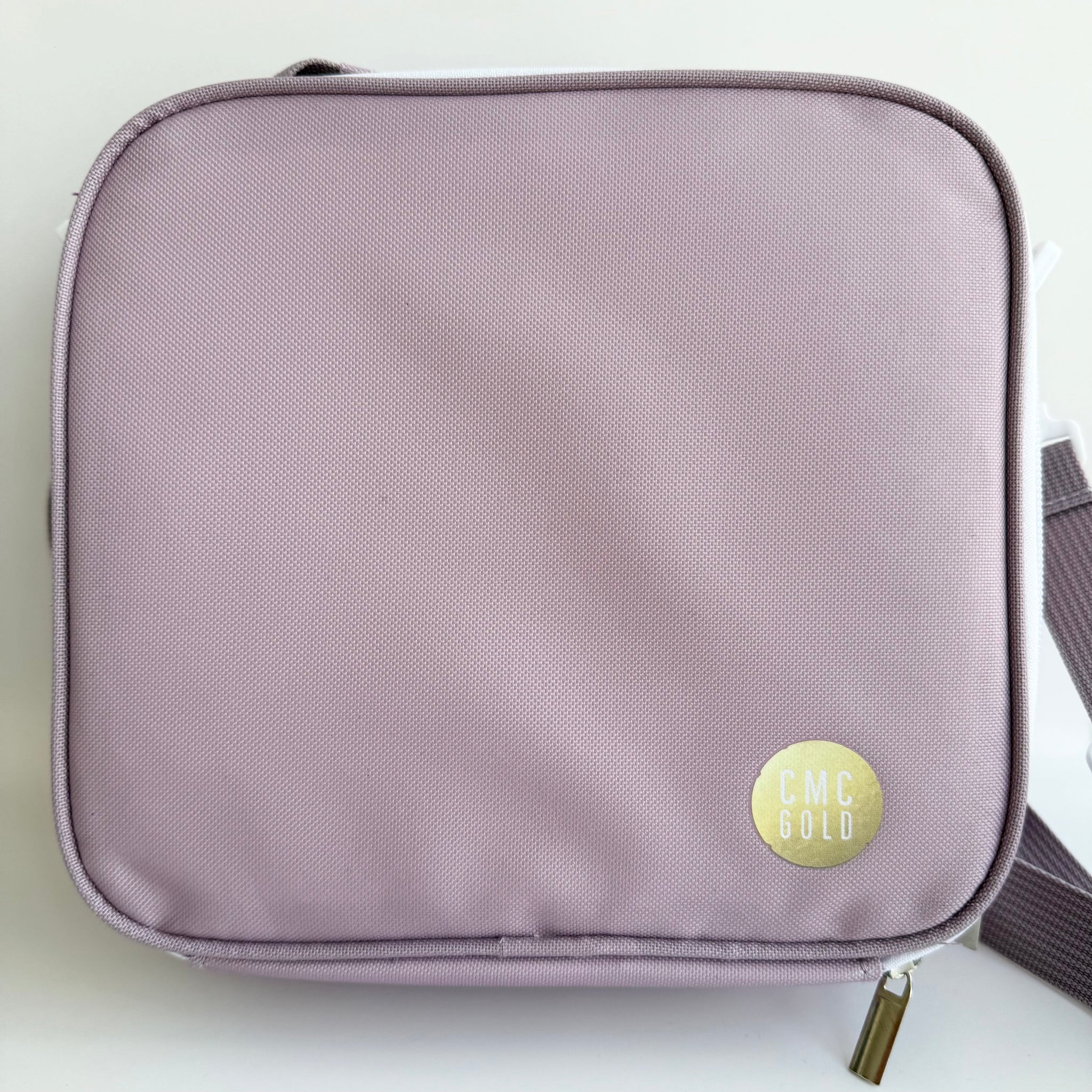 Lavender insulated kids bento lunch bag with CMC Gold logo, simple minimalist design for school or daycare