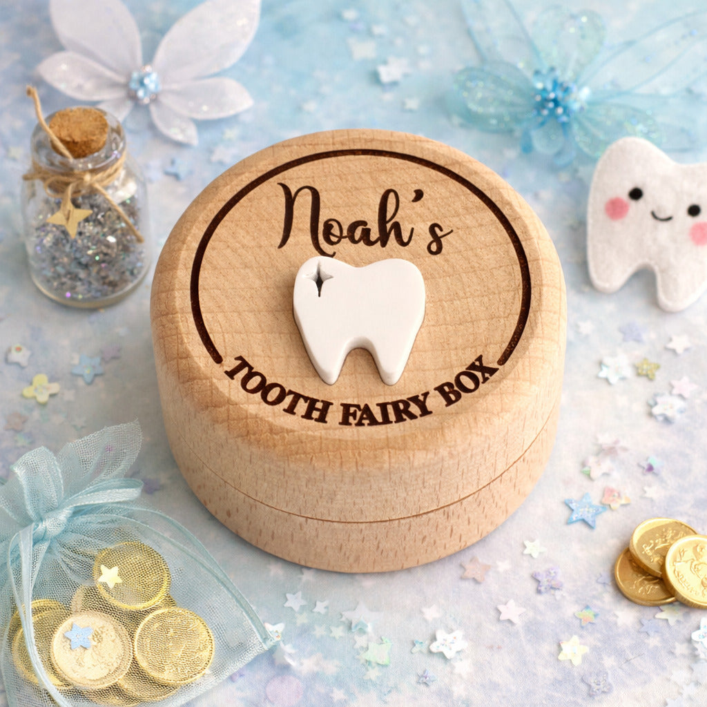 Personalised wooden tooth fairy box with engraved name Noah, featuring a white tooth detail, styled with fairy coins and soft floral decor