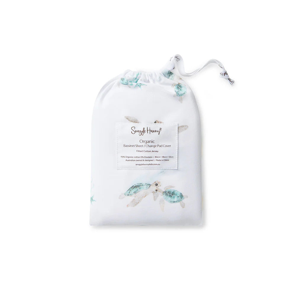 Turtle basinette sheet/ change pad cover packaged in matching drawstring storage bag with turtle pattern.