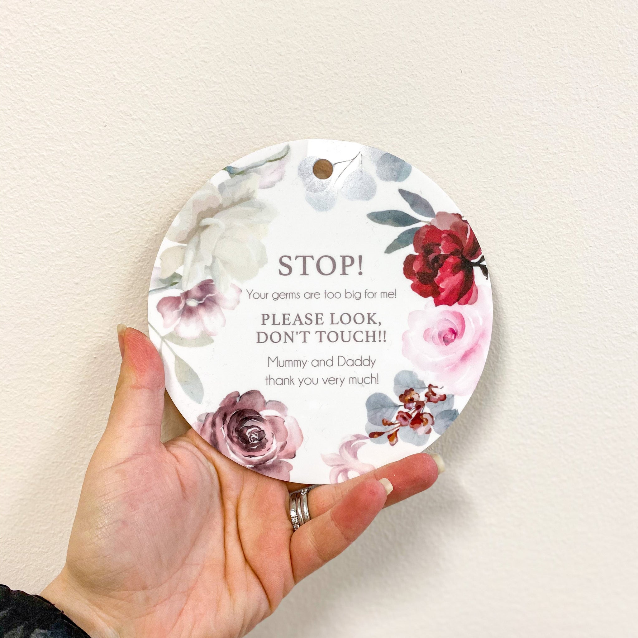 round floral newborn baby pram sign that says 